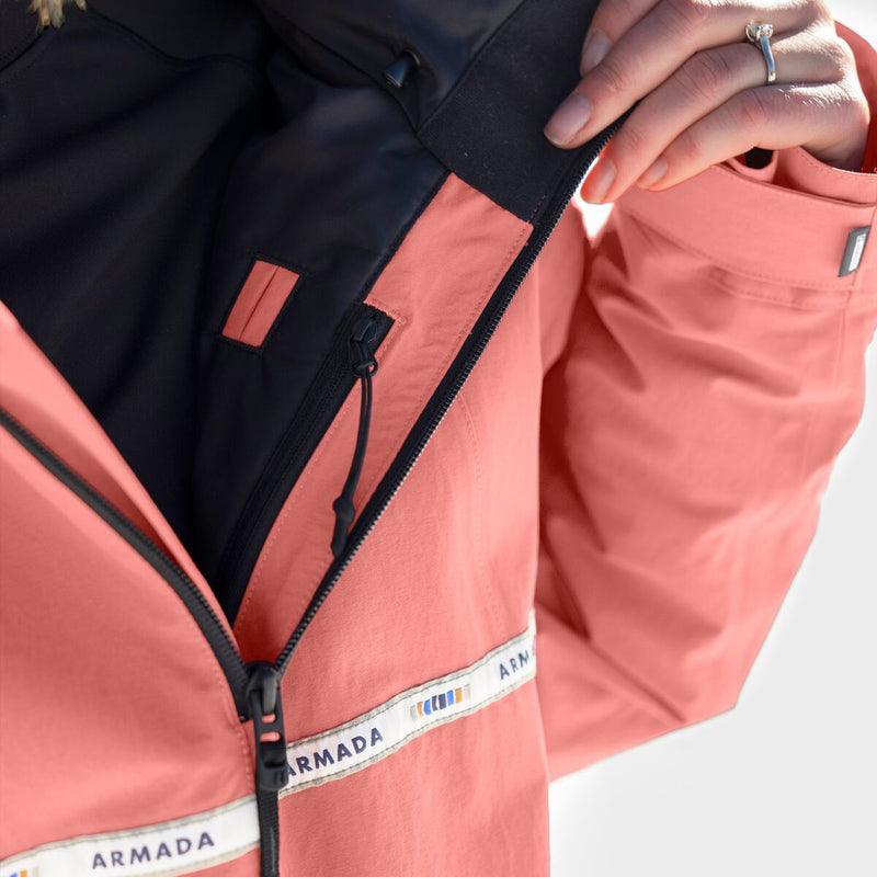 Load image into Gallery viewer, Close-up of a pink jacket with black zipper and Armada branding on a white background
