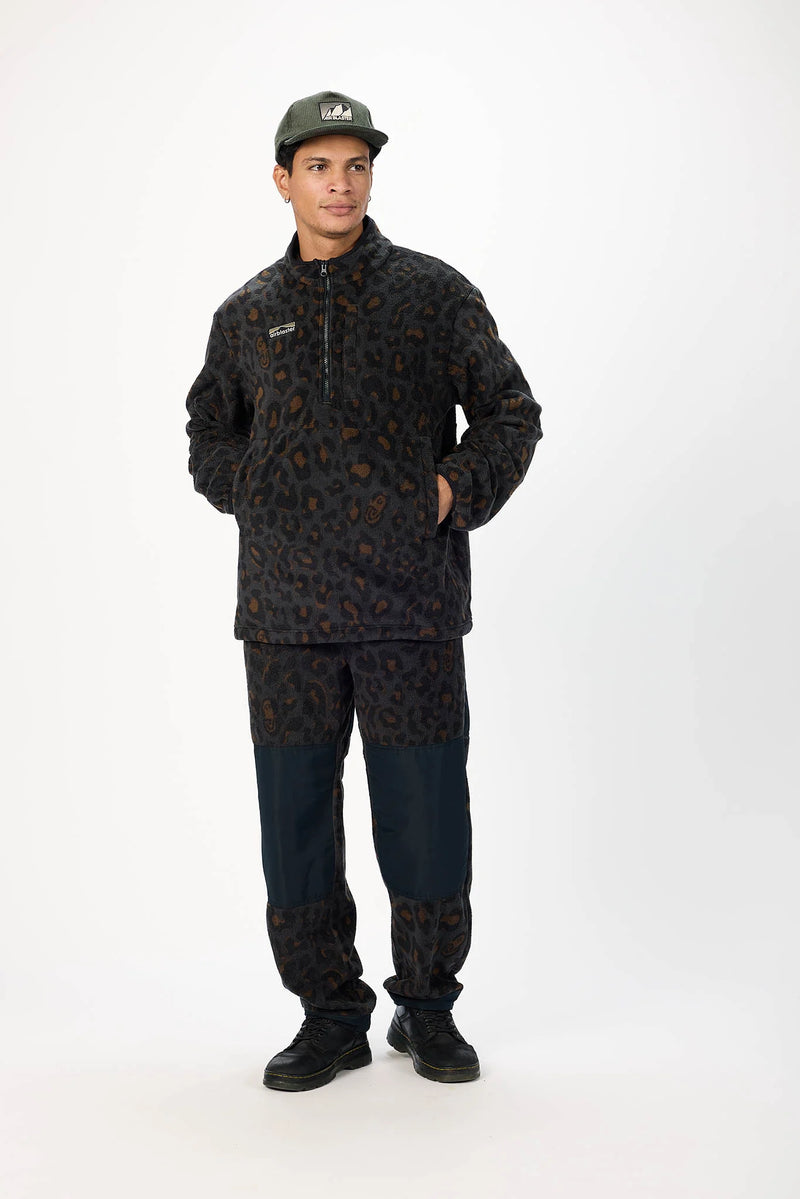 Load image into Gallery viewer, A man modeling a dark patterned Airblaster half-zip fleece jacket in a black leopard print. Ski and Tennis Station
