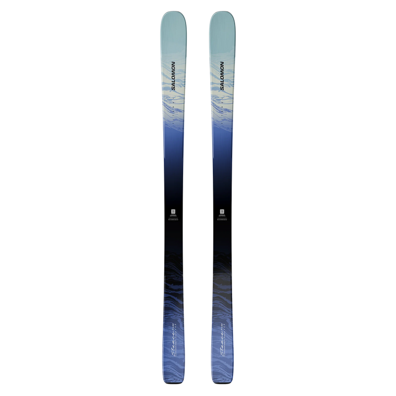 Load image into Gallery viewer, A pair of Salomon Stance 82 ski tips shown vertically against a solid white background, featuring a blue and black gradient design with white and blue abstract patterns. Ski and Tennis Station

