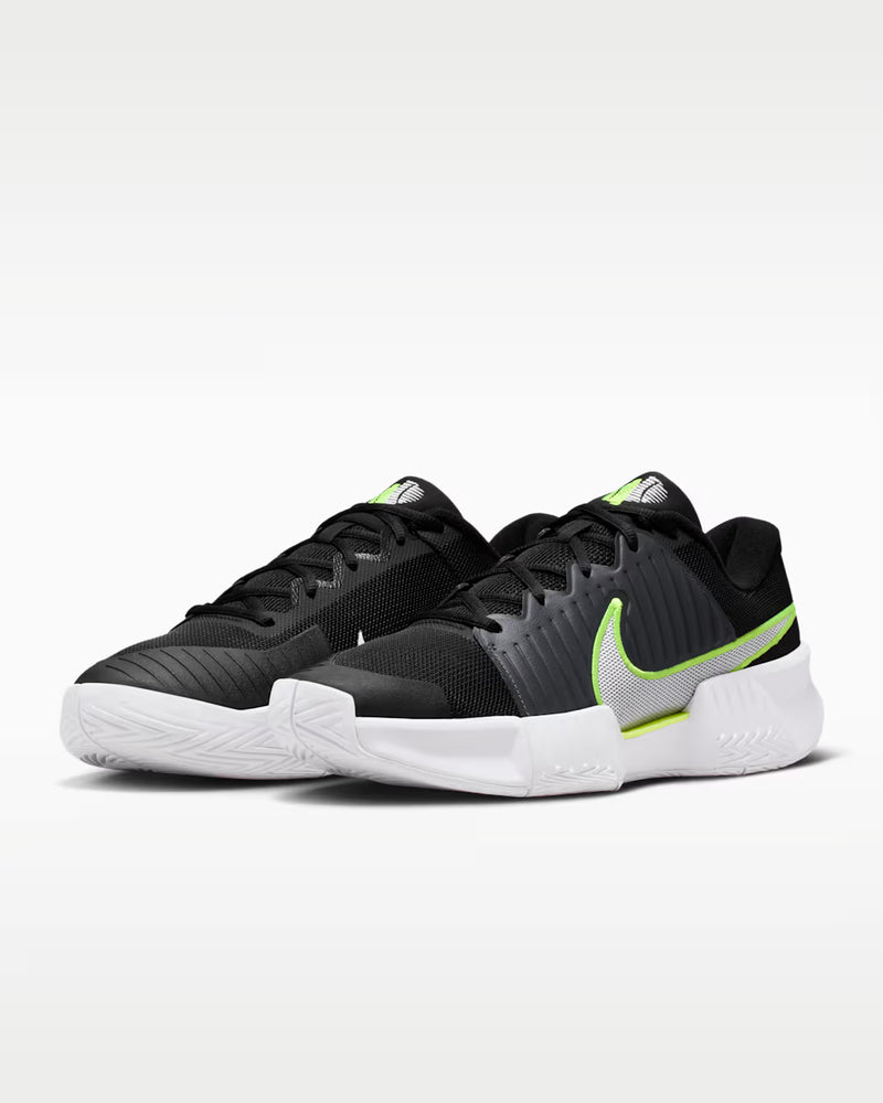 Load image into Gallery viewer, Black and green athletic shoes with a Nike logo on a white background

