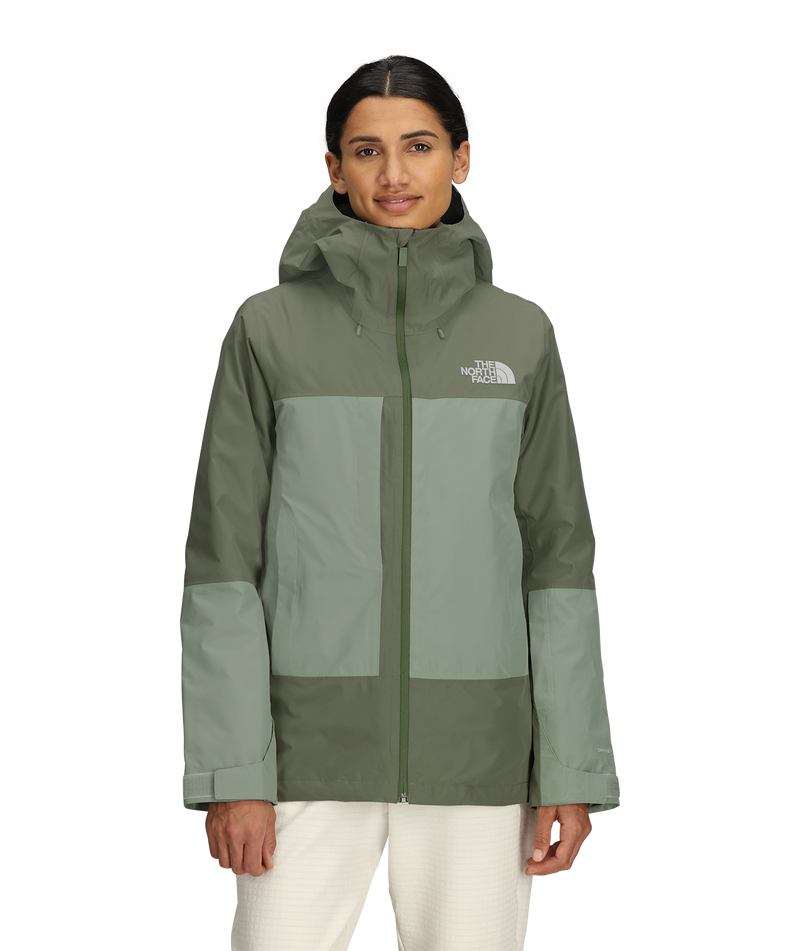 Load image into Gallery viewer, Woman wearing a green and gray jacket with The North Face logo on a white background
