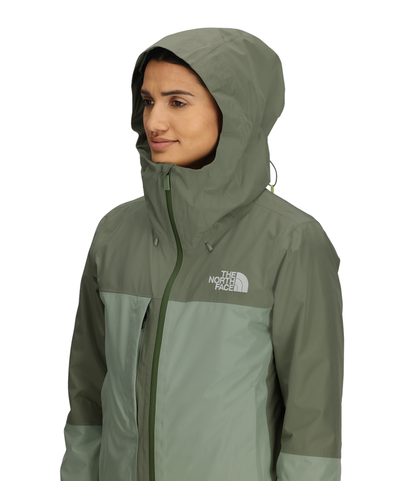 Load image into Gallery viewer, Person wearing a green jacket with The North Face logo on a white background
