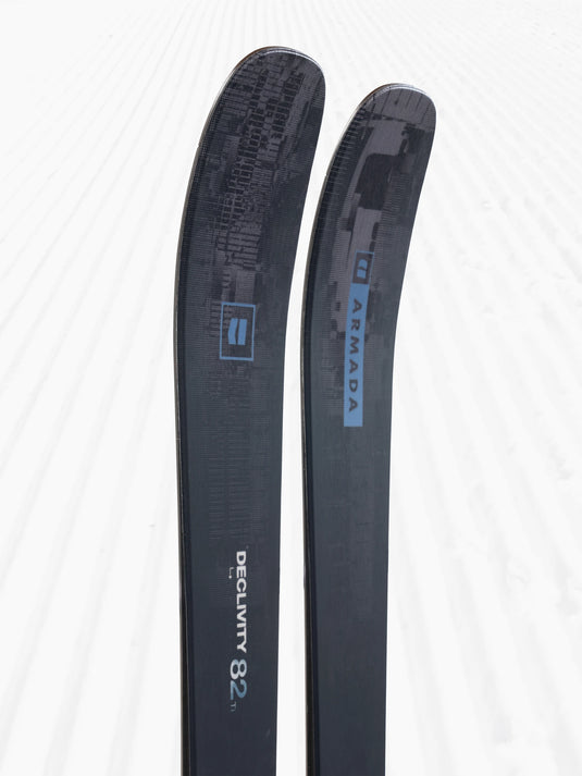 Two skis with 'Armada' branding on a white background