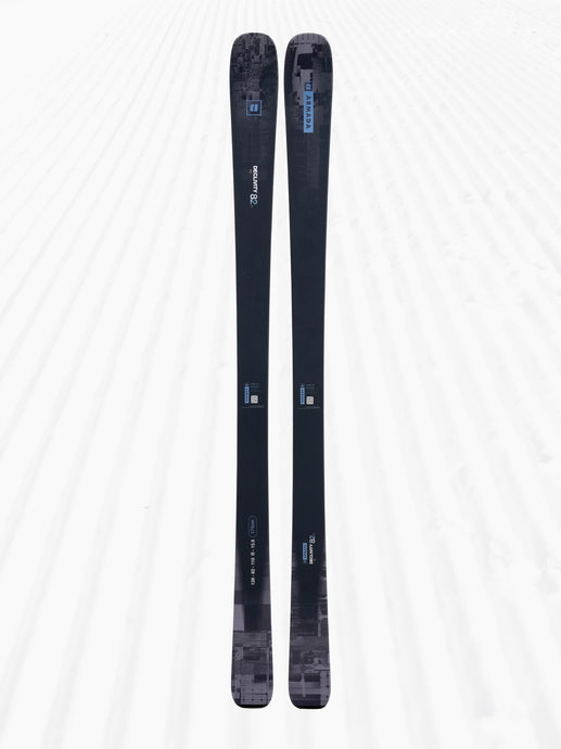 Pair of black skis with branding on a white background