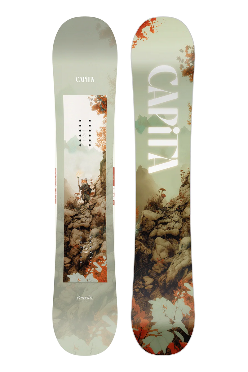 Load image into Gallery viewer, A CAPiTA snowboard shown from both sides against a plain white background. The left side features a light sage green base with a central graphic of a skier on a mountain, and the right side features a matching mountain and rock graphic in earthy tones with large white CAPiTA lettering.
