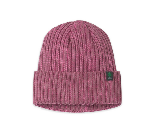 A pink ribbed knit beanie hat with a folded cuff and a small green square Stio logo patch on the side. Ski and Tennis Station