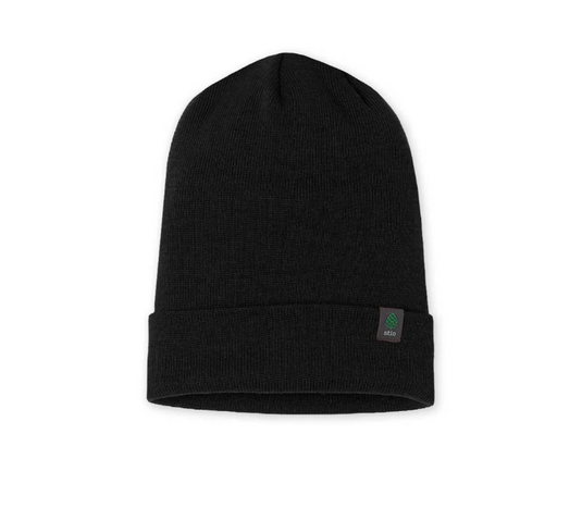 A black ribbed knit beanie hat with a folded cuff, featuring a small square Stio patch on the side. Ski and Tennis Station