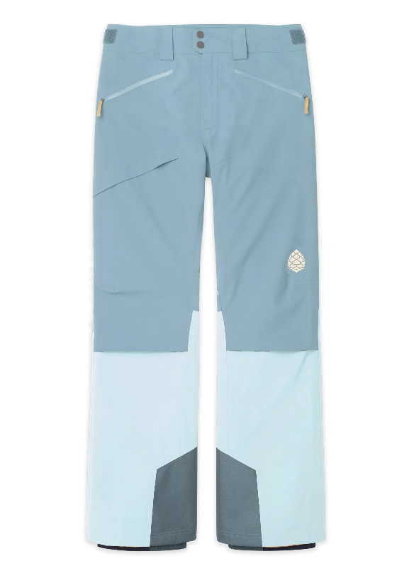 Load image into Gallery viewer, A pair of color-blocked Stio Skyrider ski or snowboard pants in dusty blue, light blue, and dark gray, featuring a small white geometric logo on the left thigh. Ski and Tennis Station.
