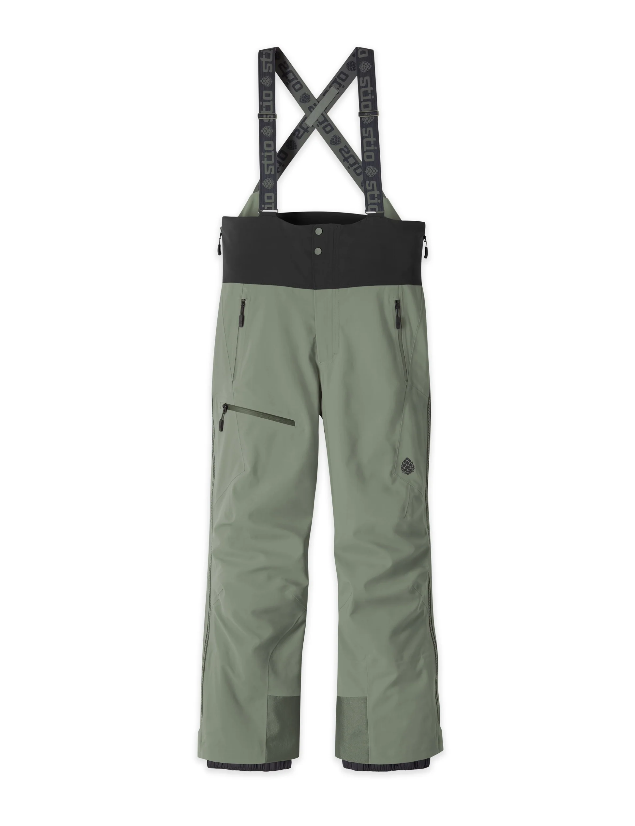 Load image into Gallery viewer, Light green Stio Environ snow bib pants with adjustable suspenders, shown flat against a white background. Ski and Tennis Station.
