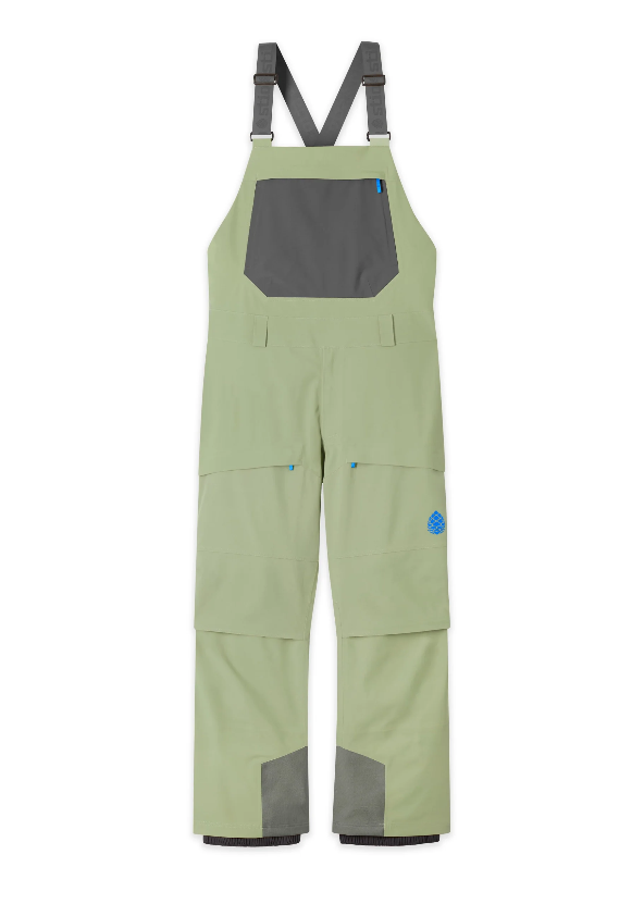 Load image into Gallery viewer, Light sage green bib overalls from Stio with dark gray contrast panels on the chest pocket, suspenders, and lower legs, shown flat against a white background. Ski and Tennis Station.
