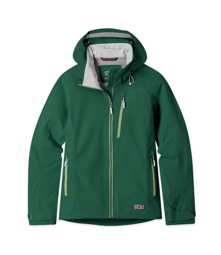 Load image into Gallery viewer, A dark green hooded Stio jacket with a light gray interior lining, featuring a full-length front zipper, zippered hand pockets, and a small pink 'stio' logo near the bottom hem. Ski and Tennis Station

