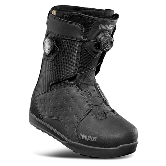 Black snowboard boot with 'thirtytwo' branding on a white background