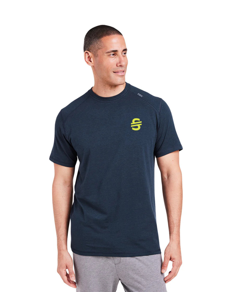 Load image into Gallery viewer, Man wearing a navy t-shirt with a yellow ski and tennis station logo on a white background
