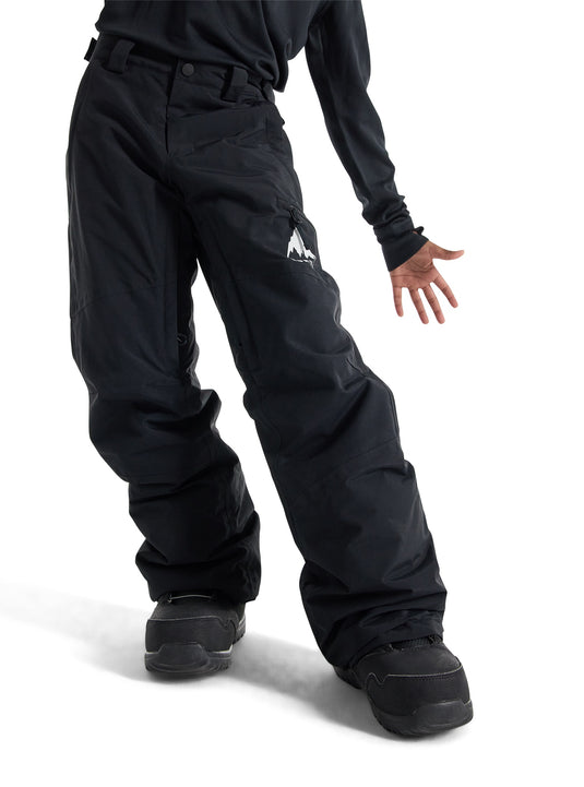 Person wearing black snow pants with a visible brand logo on a white background
