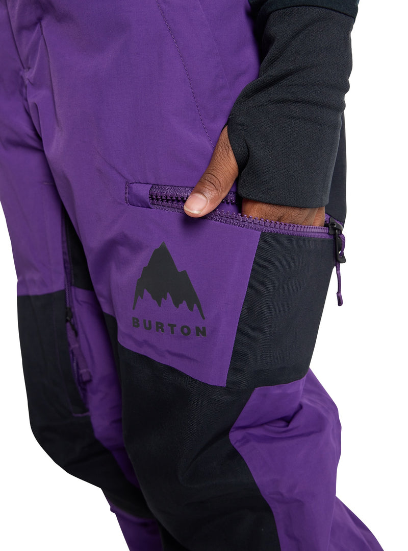 Load image into Gallery viewer, Purple and black Burton snow pants with a mountain logo on a white background

