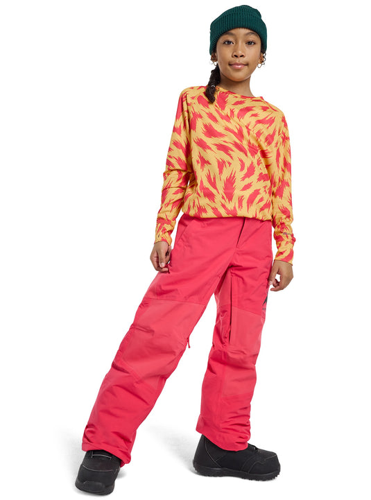 Person wearing a colorful outfit with a pink snowsuit and patterned top on a white background