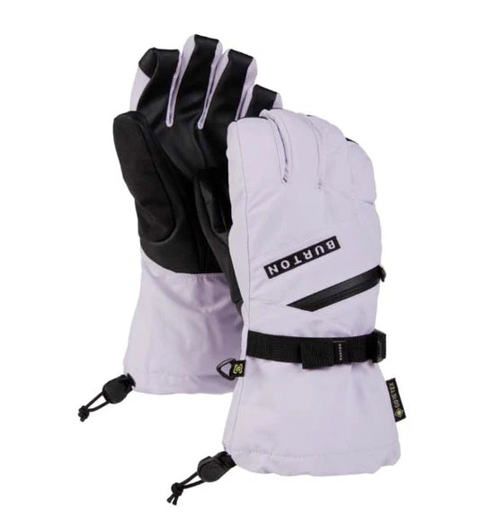 A pair of Burton snowboard gloves in light lavender and black, featuring a wrist strap and thumb release, shown against a plain white background. Ski and Tennis Station