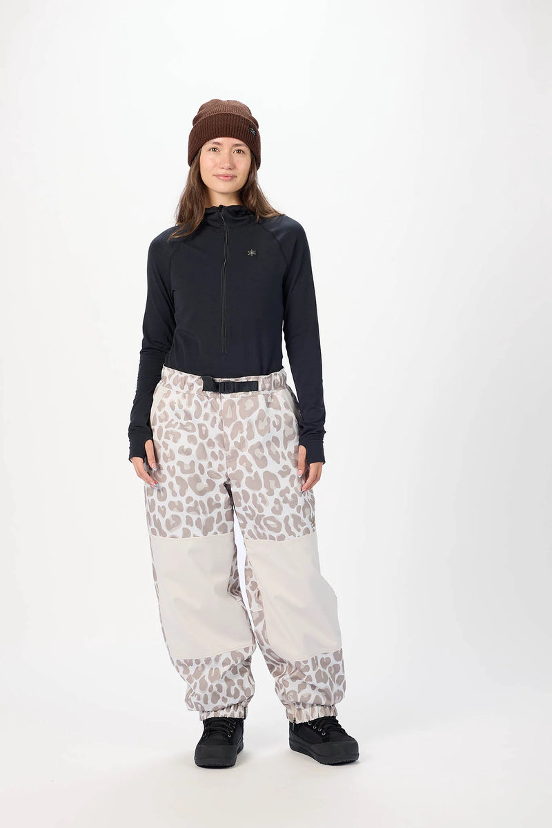 Load image into Gallery viewer, Model wearing Airblaster leopard-print snow pants. Ski and Tennis Station
