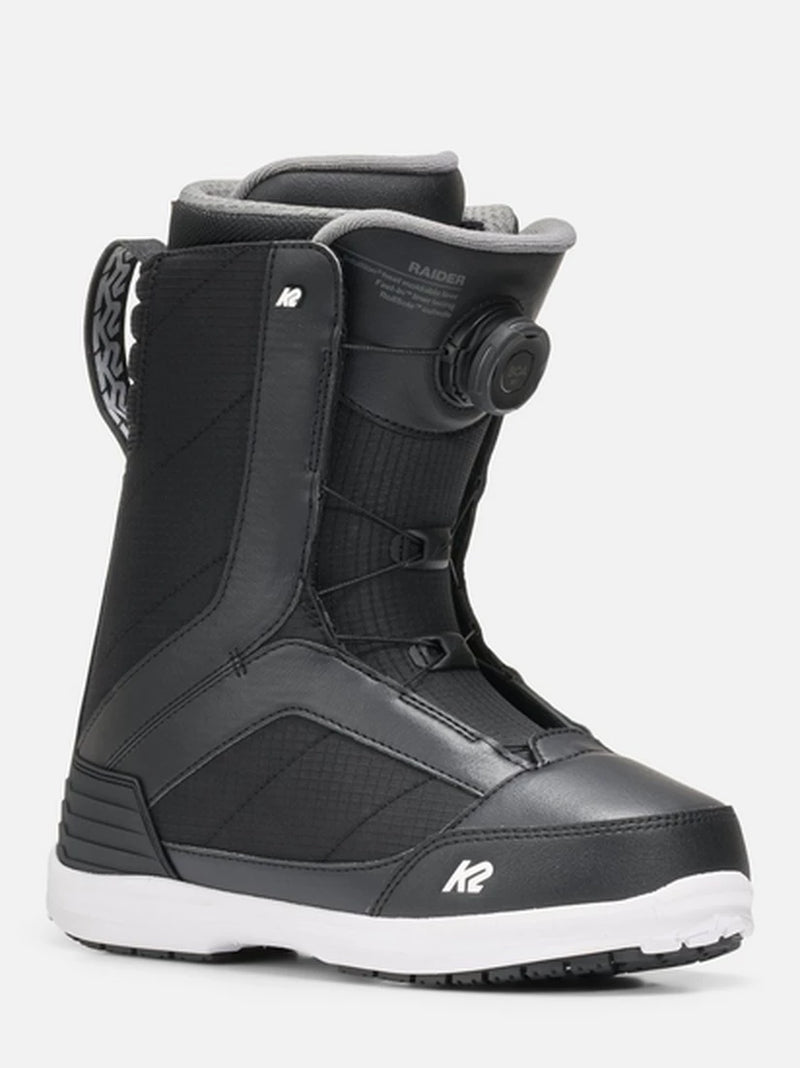 Load image into Gallery viewer, A black K2 Raider snowboard boot with a white sole, featuring a BOA dial closure system and a white K2 logo on the toe, shown against a light gray background.
