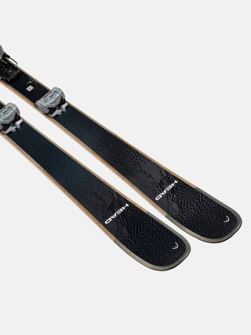 Load image into Gallery viewer, Pair of black skis with bindings on a light gray background
