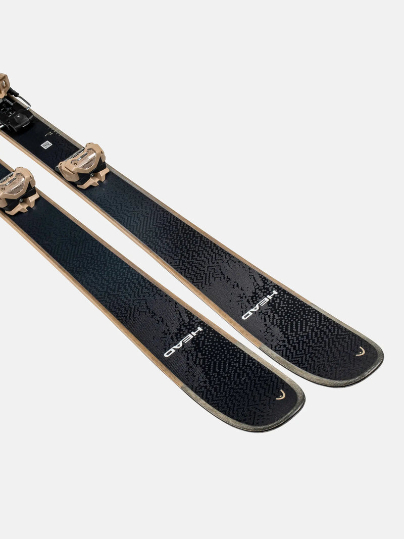 Load image into Gallery viewer, Pair of black skis with gold bindings on a white background

