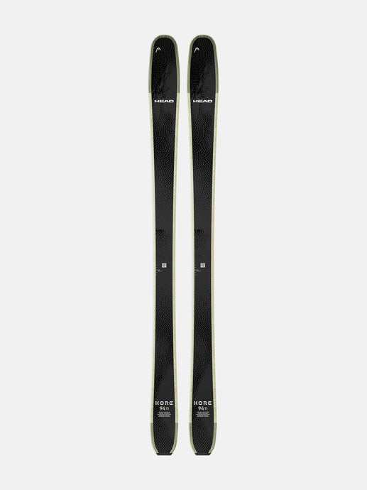 Two black skis with visible branding on a white background