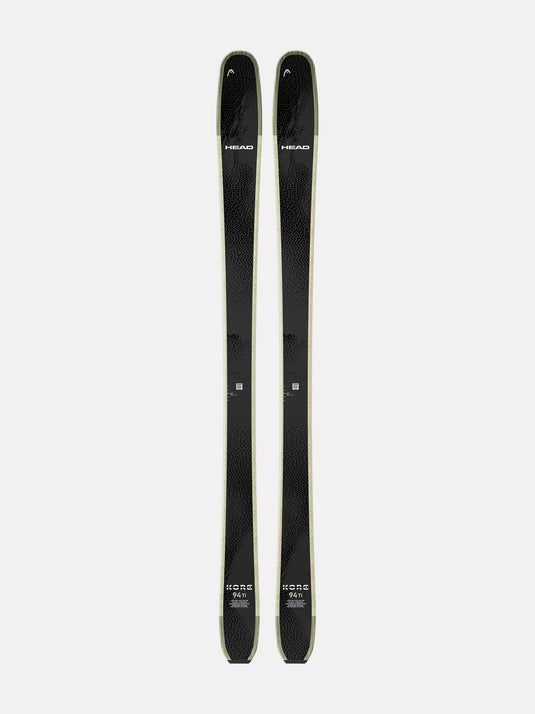 Two black skis with visible branding on a white background