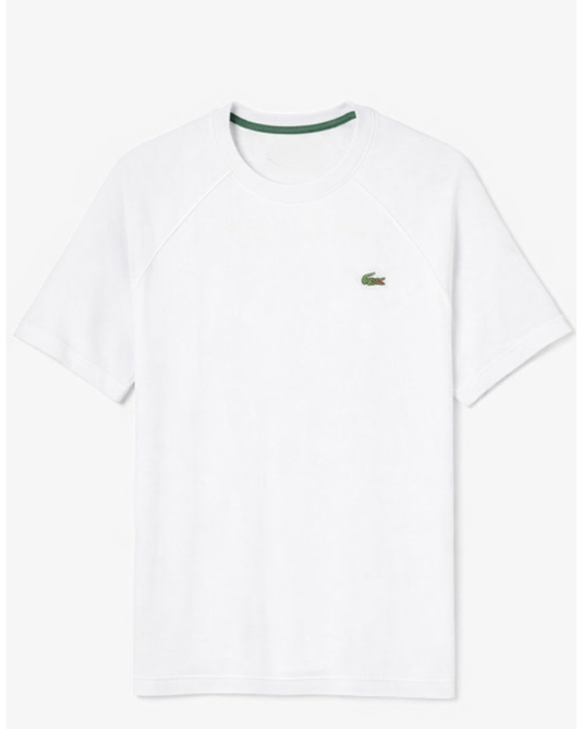 White t-shirt with a green Lacoste logo on a white background