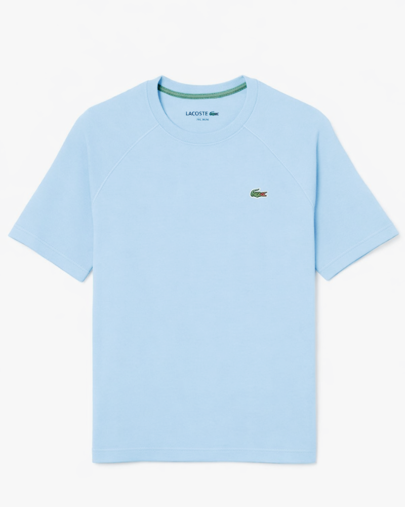 Load image into Gallery viewer, Light blue t-shirt with Lacoste logo on a white background
