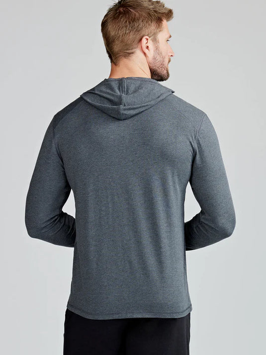 Man wearing a gray hoodie from behind on a light gray background